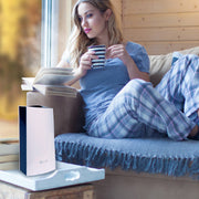 LivePure Ultrasonic Cool Mist Tabletop Humidifer LP450HUM Sitting on Table While Girl Relaxes and Reads